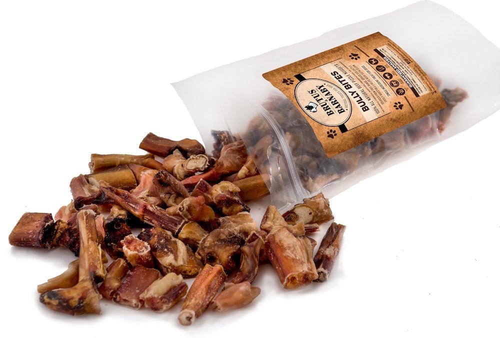 All-natural bully bites dog treats spilling from bag, USA-made chews for safe digestibility